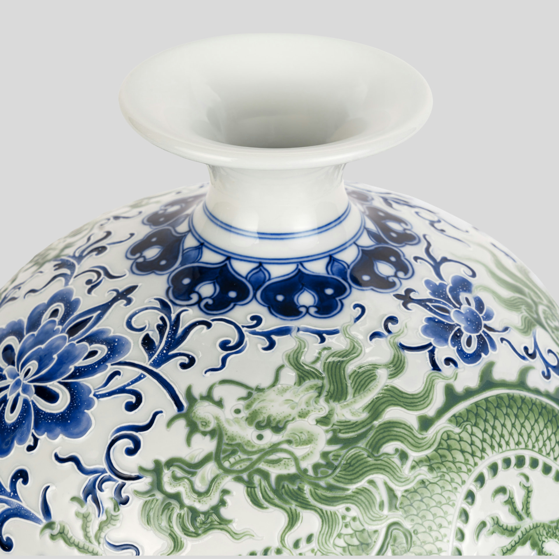 Close-up of a blue and green hand-painted Chinese porcelain vase