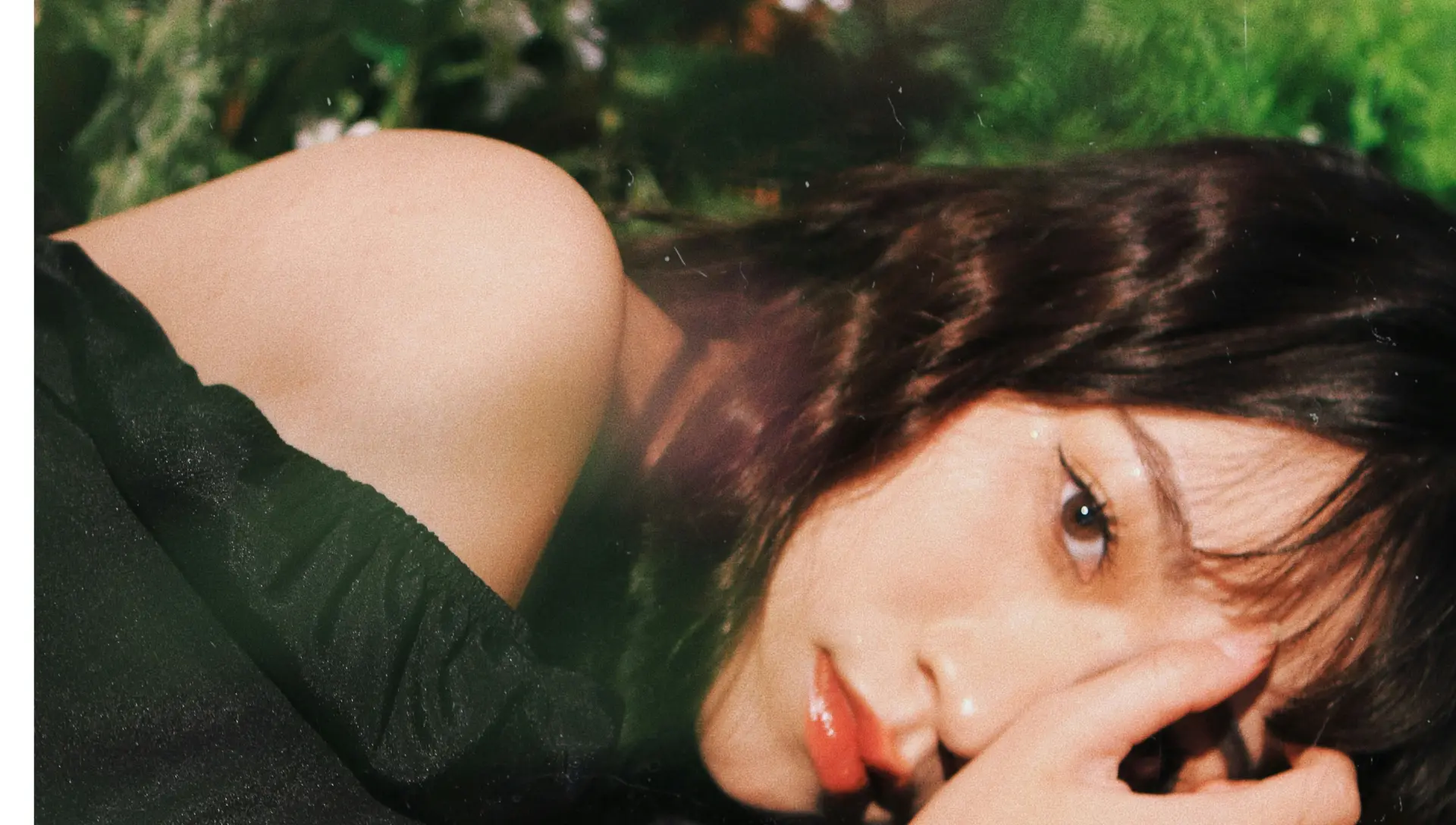 Portrait of a person resting outdoors in soft daylight