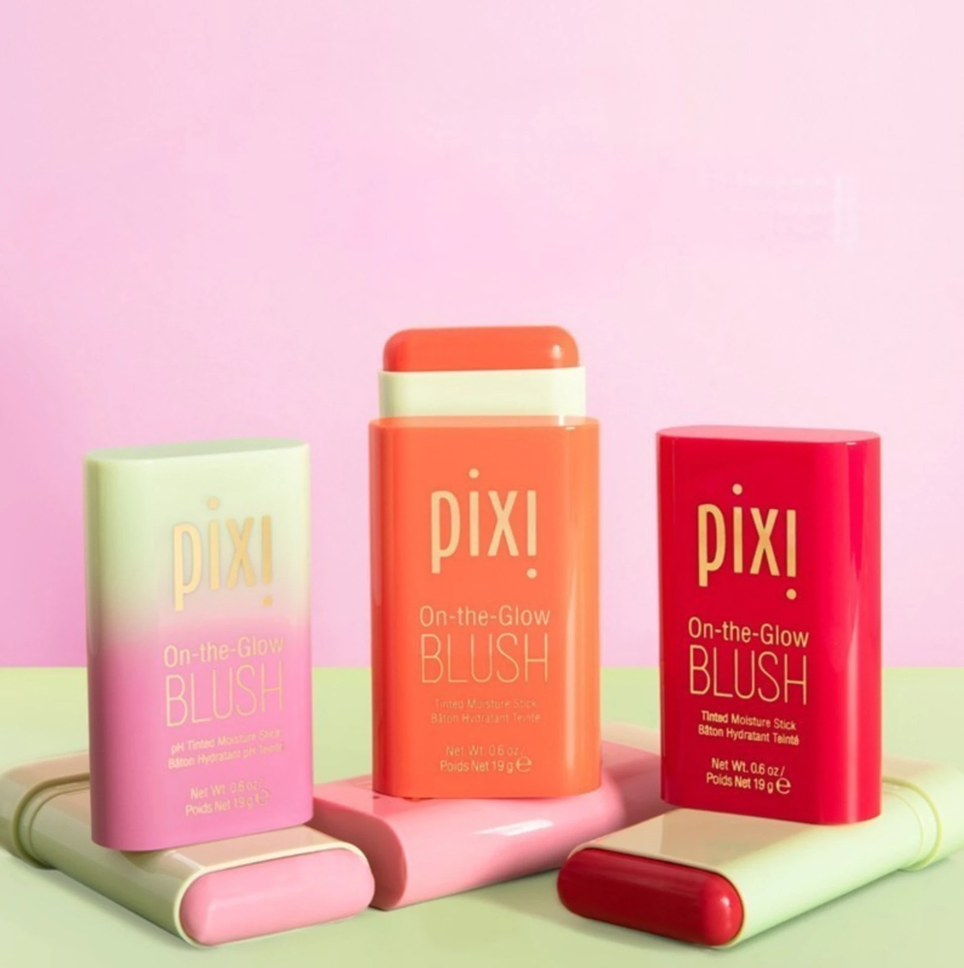 Pixi On-the-Glow blush sticks on a pink and green set